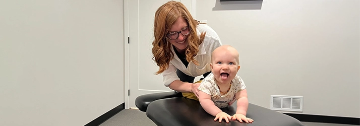 Chiropractor Lawrence KS Abby Hanson﻿ Adjusting Pediatric Patient
